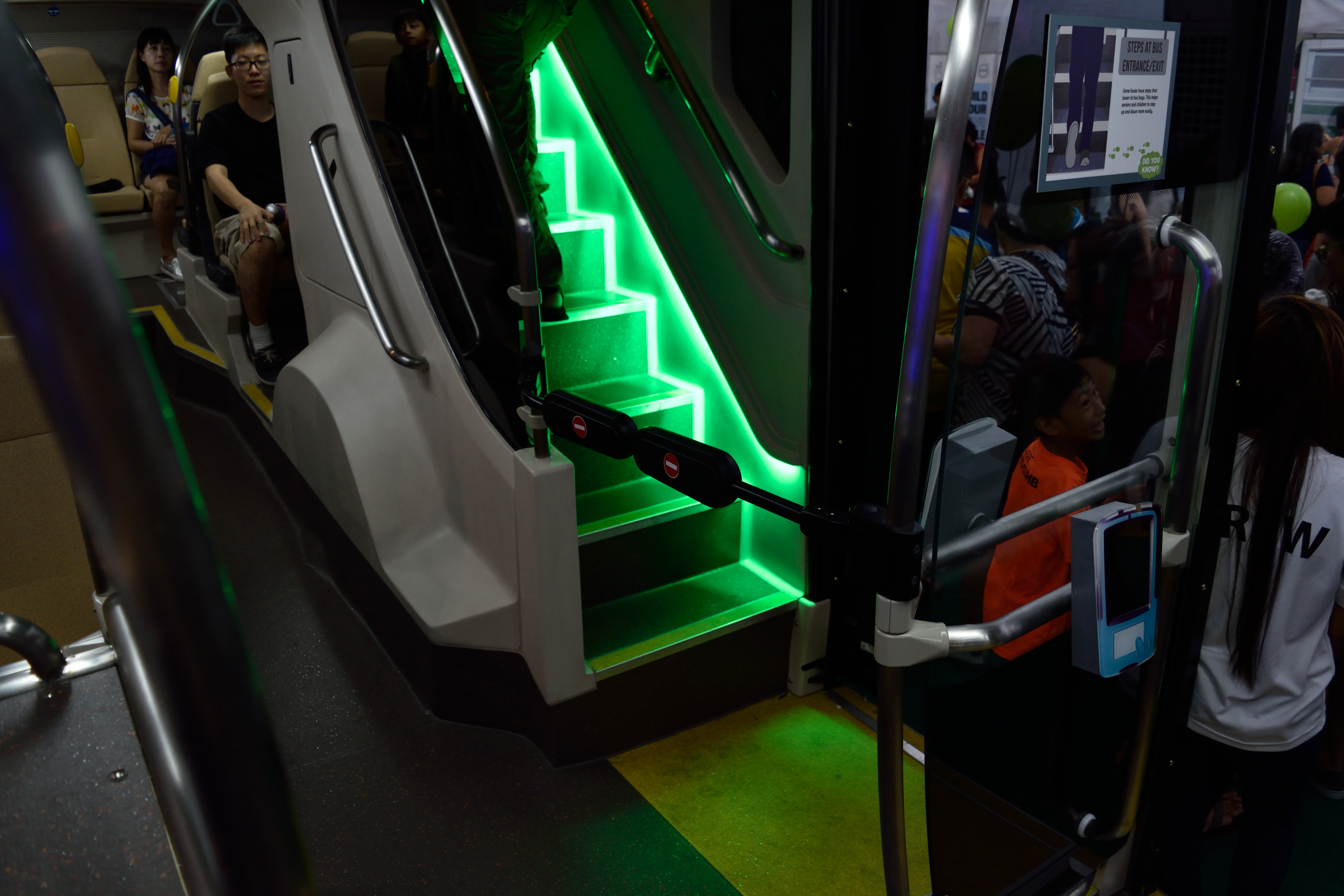 The third door and rear stairs is cordoned off from the rest of the bus.